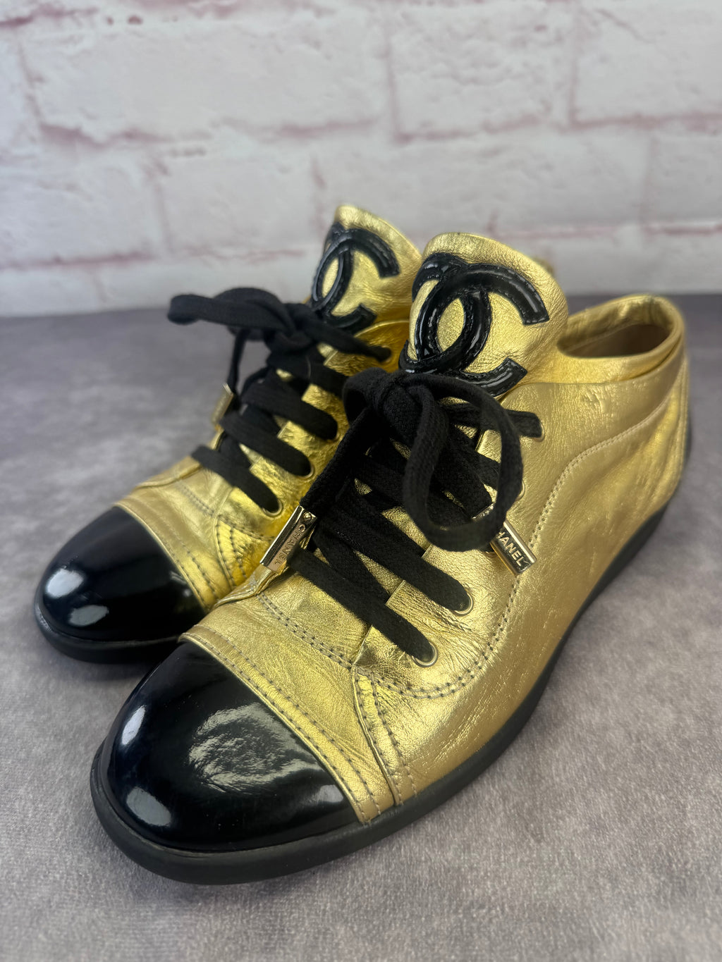 Chanel Gold BlackPatent And Leather Cap Toe Sneakers