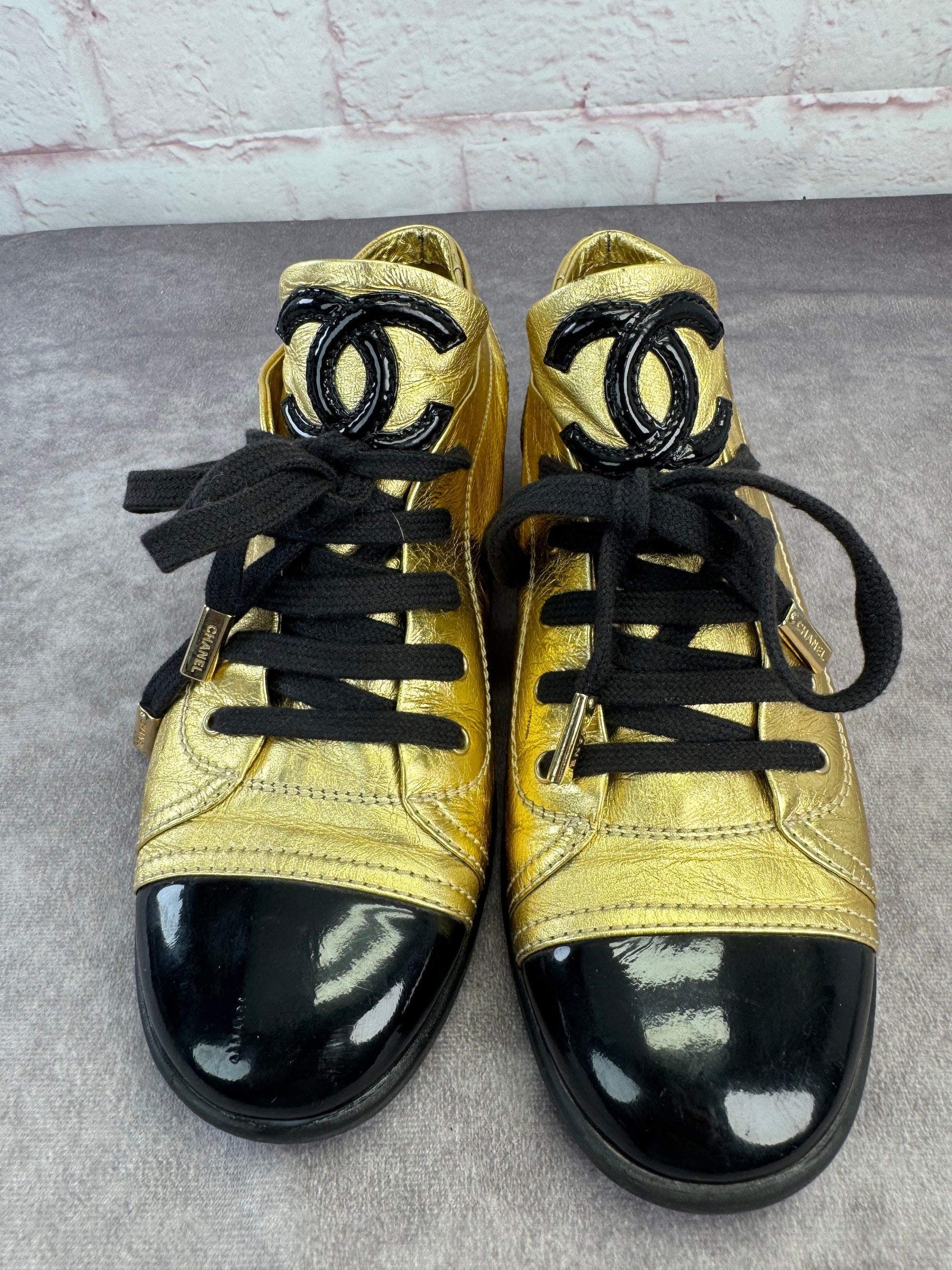 Chanel Gold BlackPatent And Leather Cap Toe Sneakers