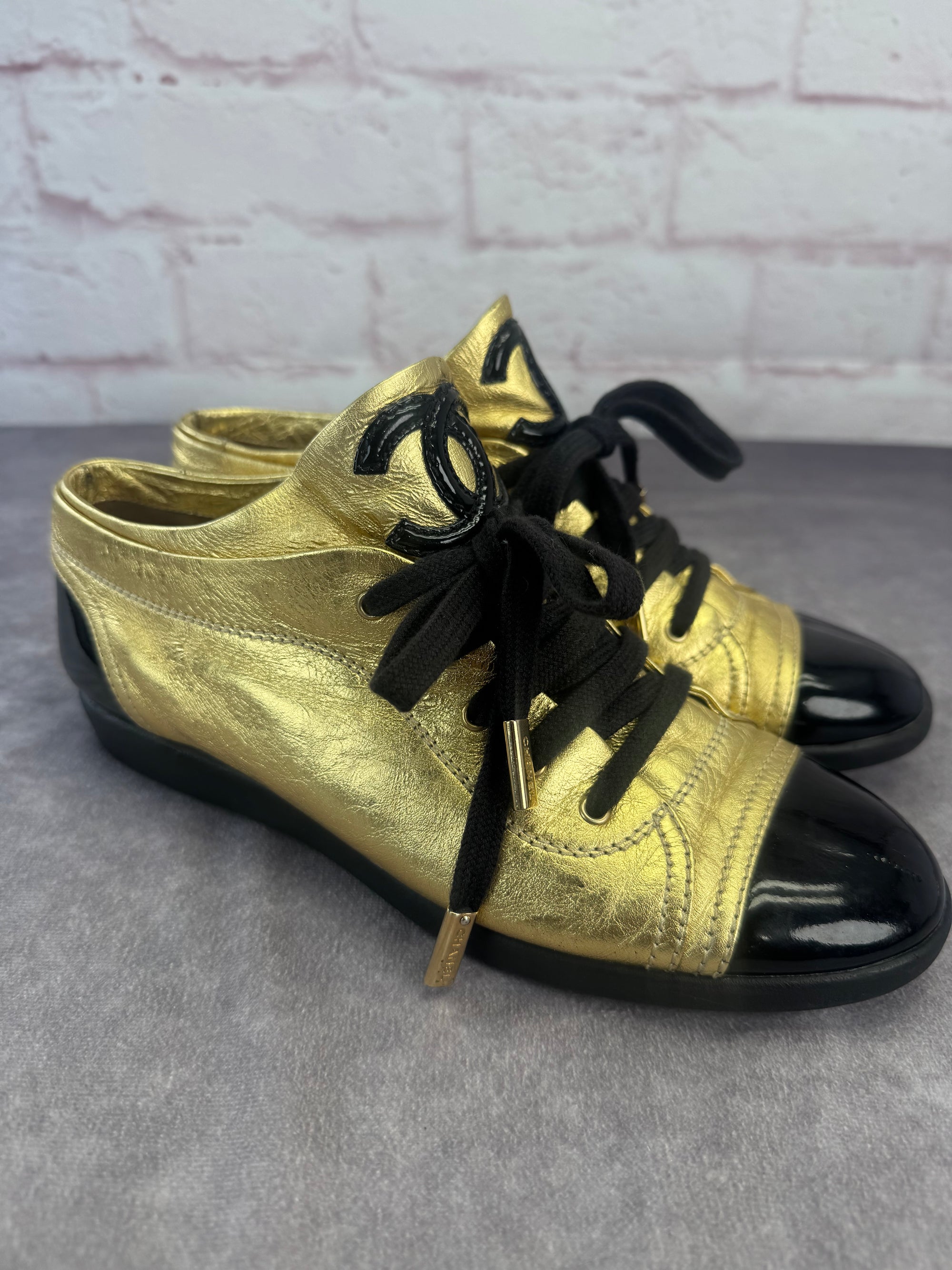 Chanel Gold BlackPatent And Leather Cap Toe Sneakers