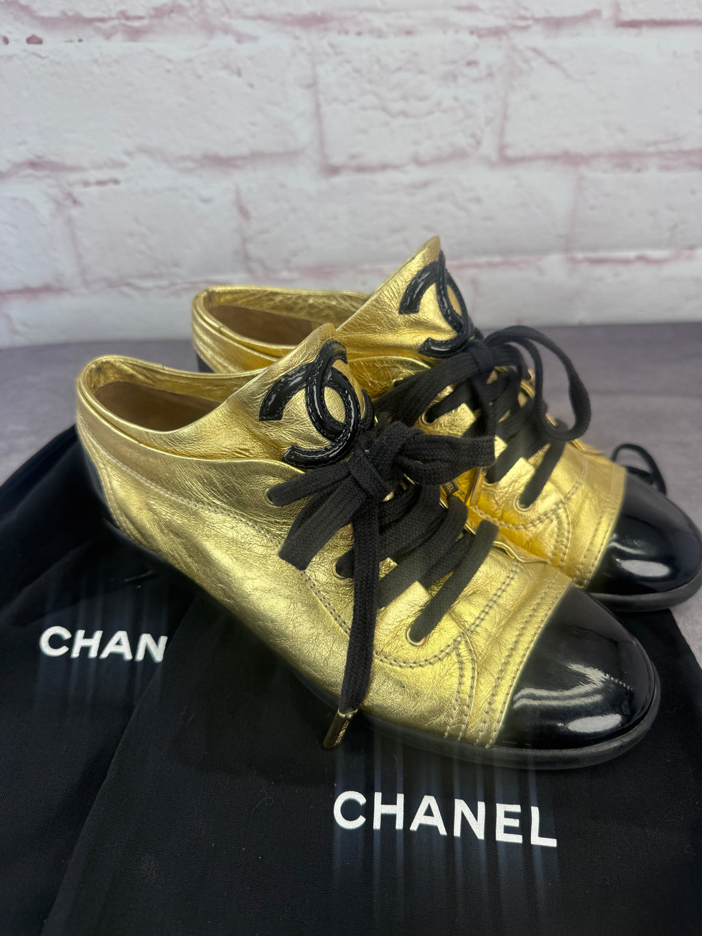 Chanel Gold BlackPatent And Leather Cap Toe Sneakers
