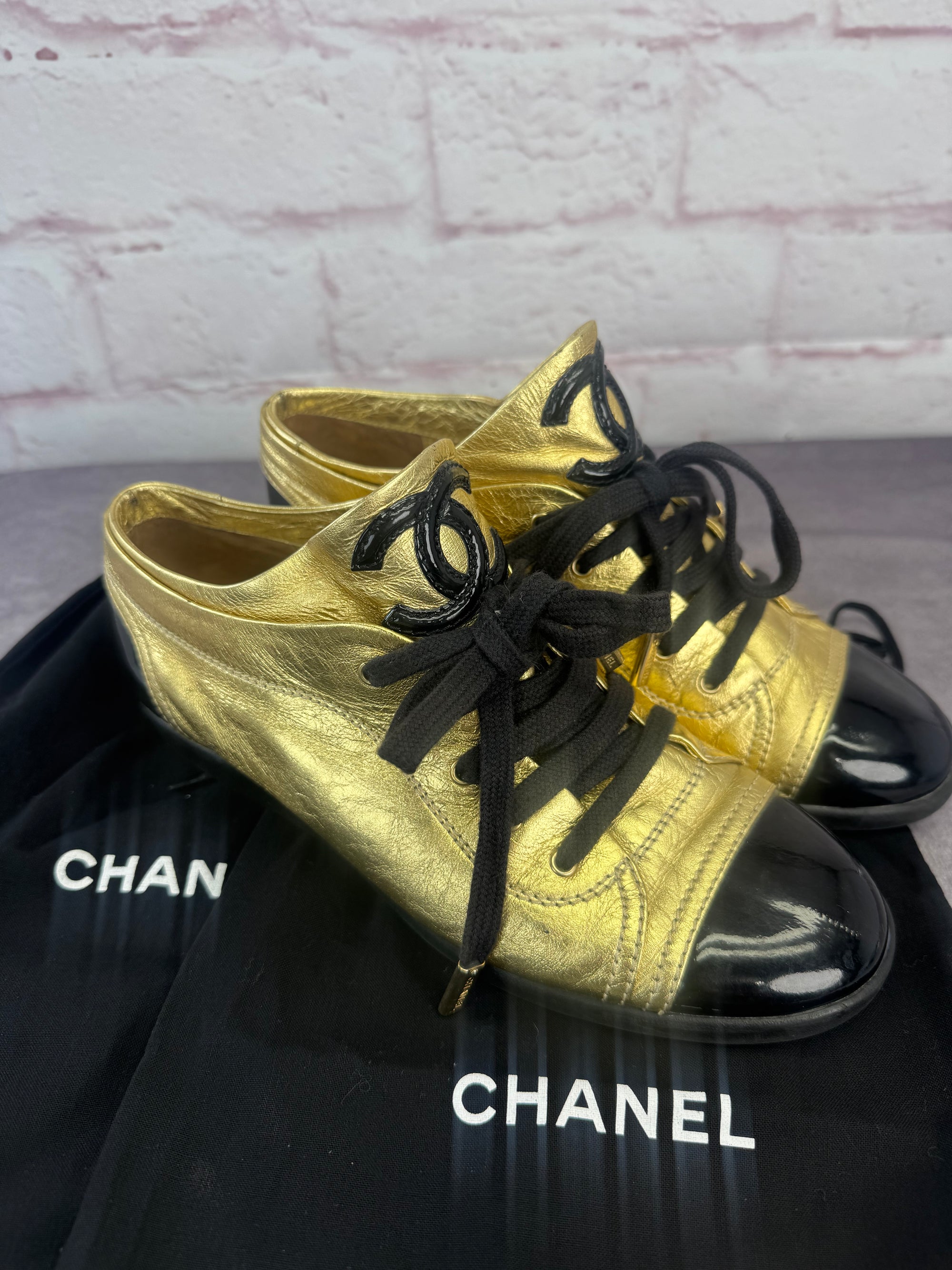 Chanel Gold BlackPatent And Leather Cap Toe Sneakers