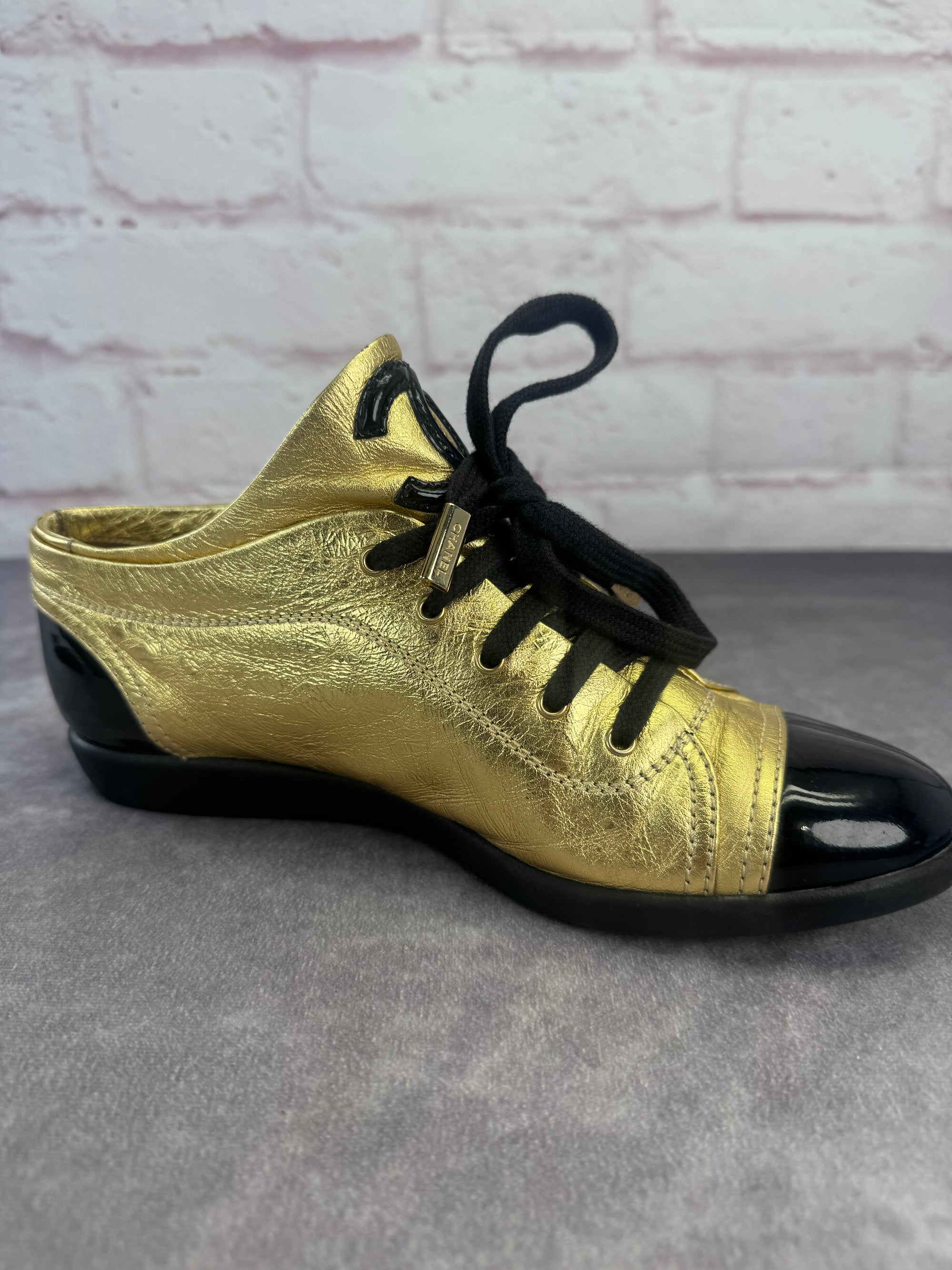 Chanel Gold BlackPatent And Leather Cap Toe Sneakers